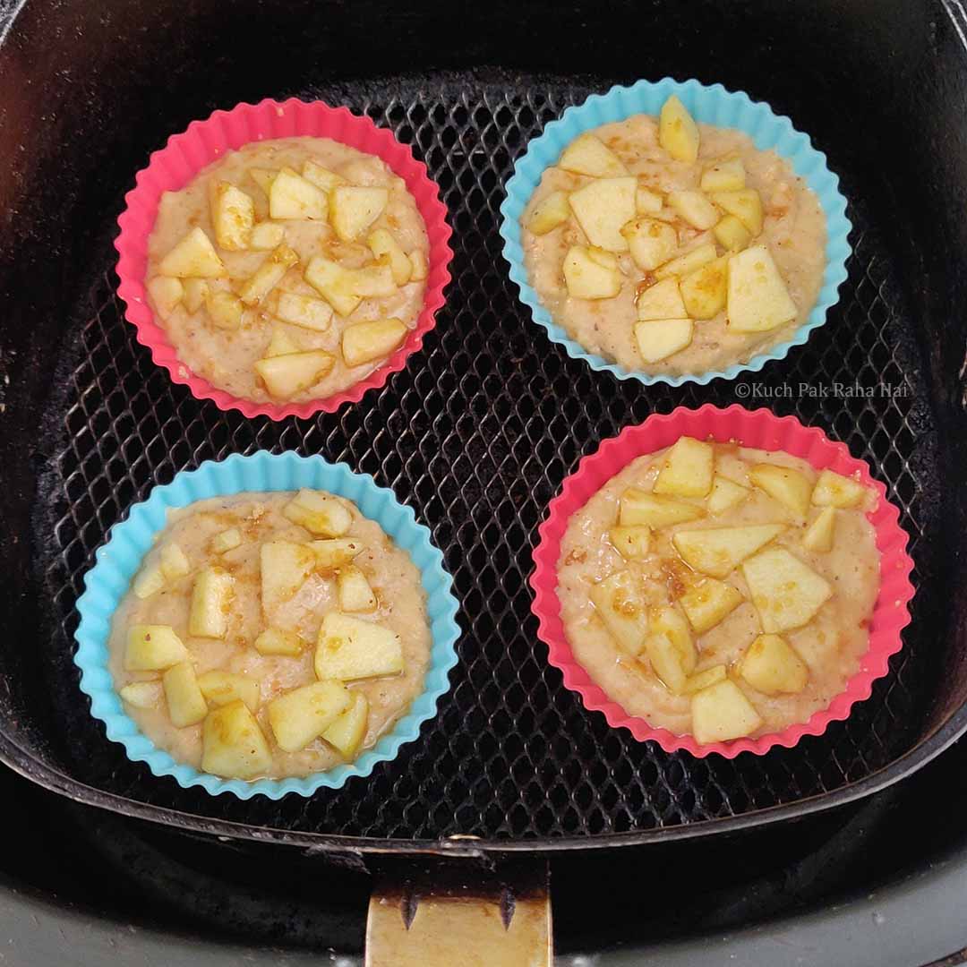 Baking apple muffins in air fryer.