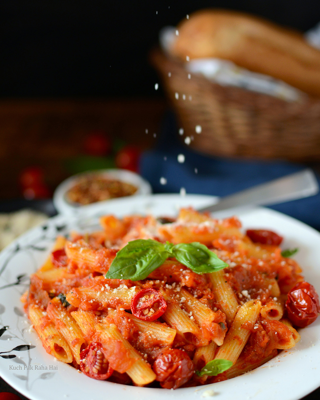 Parmesan cheese sprinkled over Arrabbiata Pasta