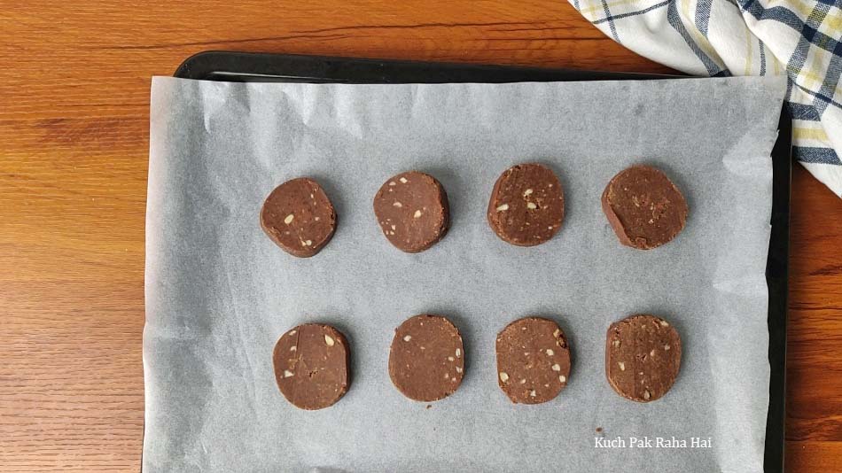 Slicing the cookies before baking.