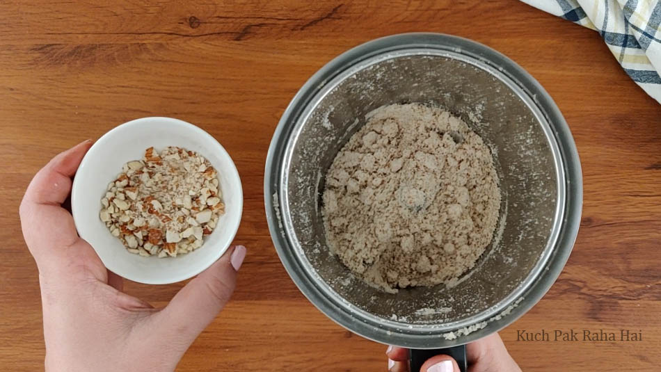 Grinding almonds for cookies.