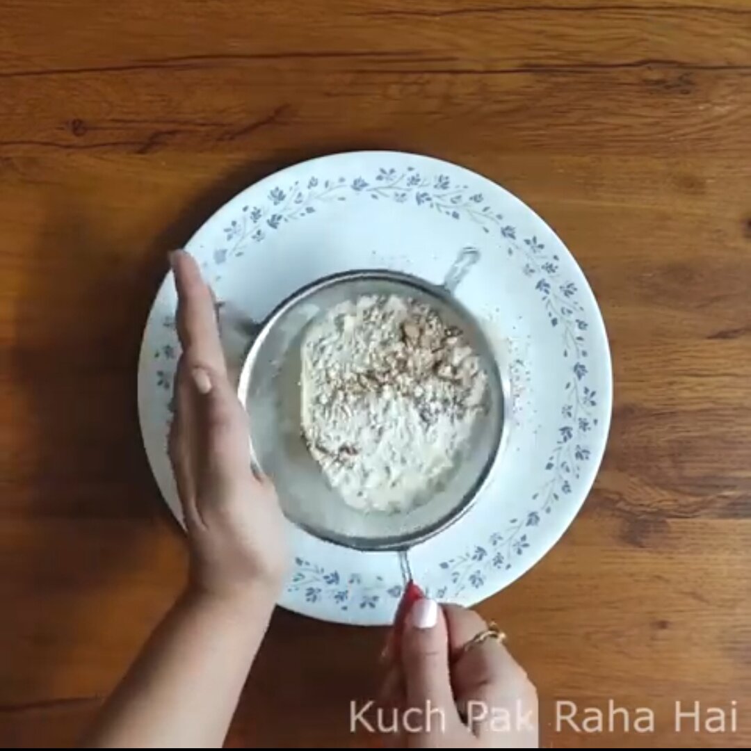 Sieving dry ingredients.