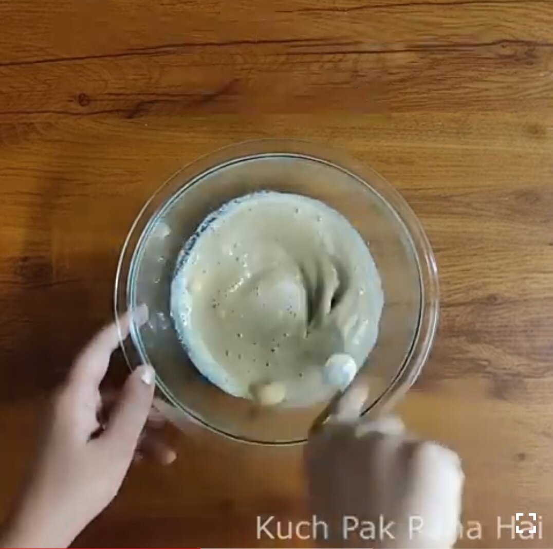 Mixing wet ingredients in a bowl.