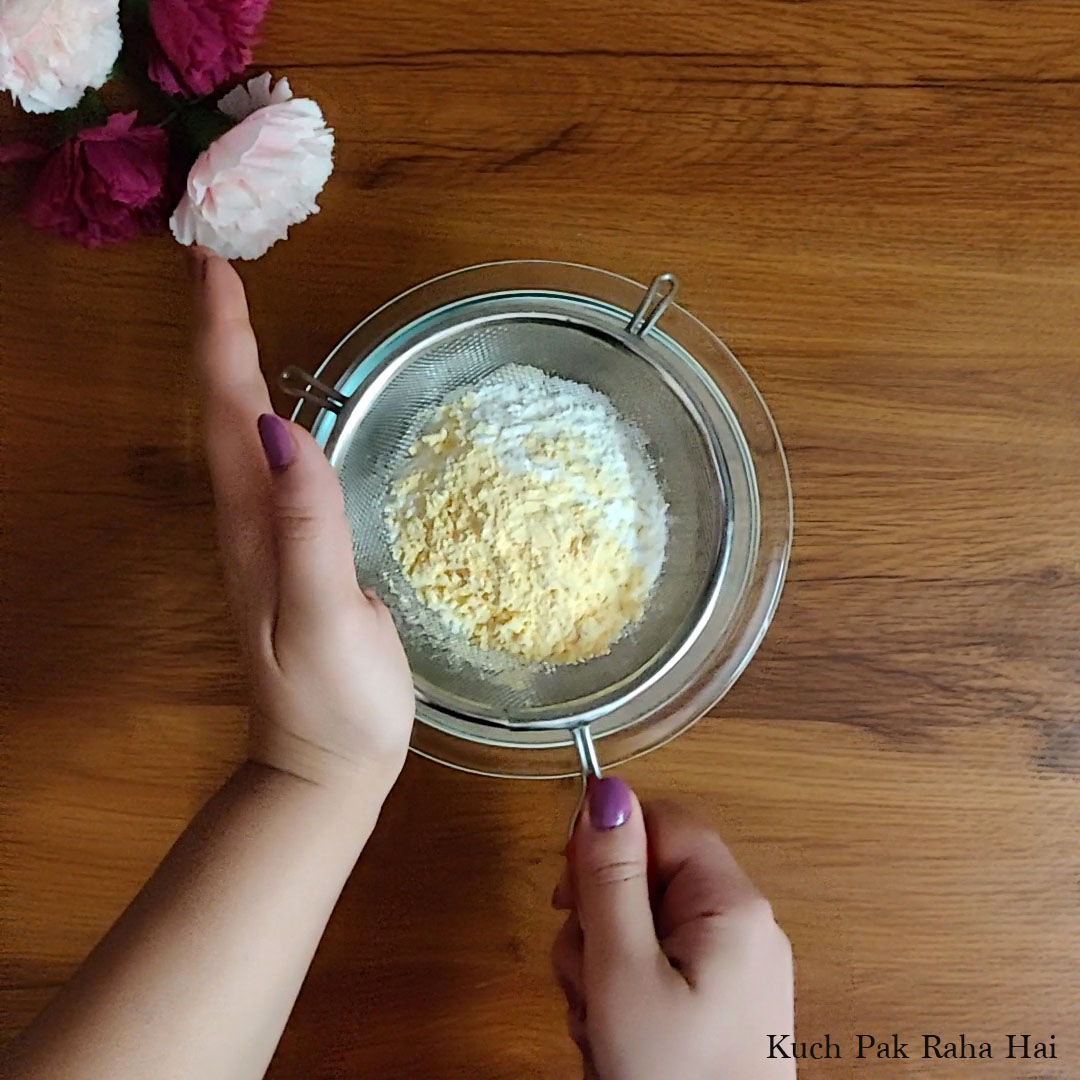 Sieving dry ingredients for cookies.