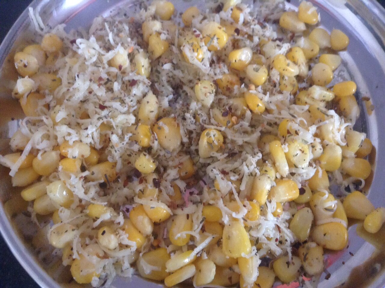 Mixing cheese, corn and seasoning.