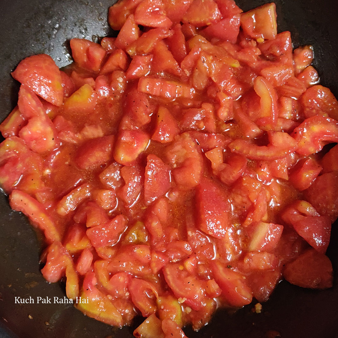 Cooking tomatoes for red sauce.