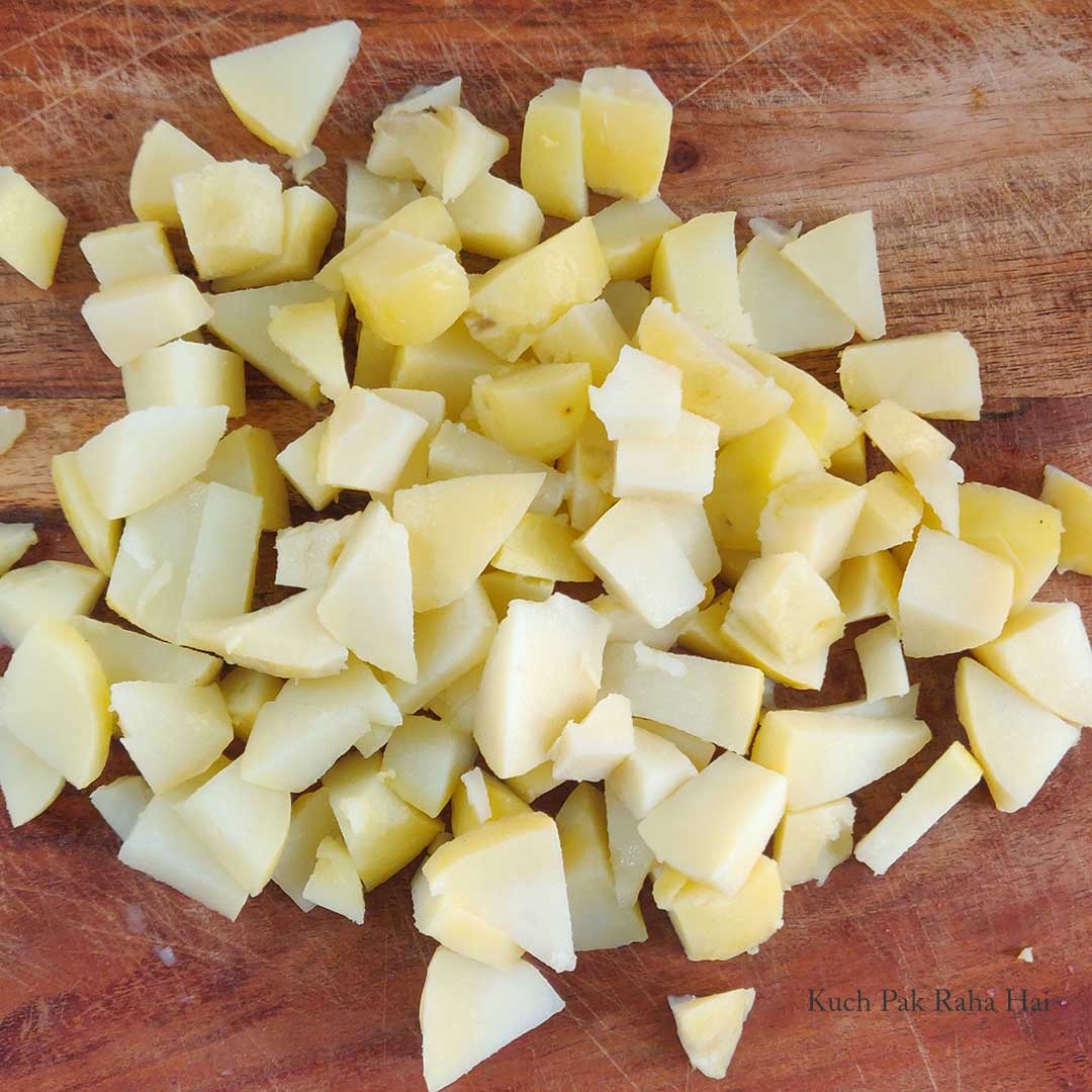 Diced potatoes on chopping board.