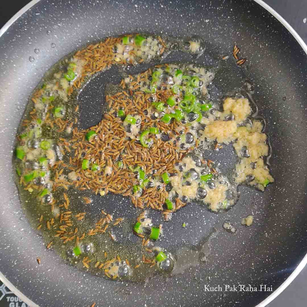 Sautéing cumin (jeera),ginger and green chillies.