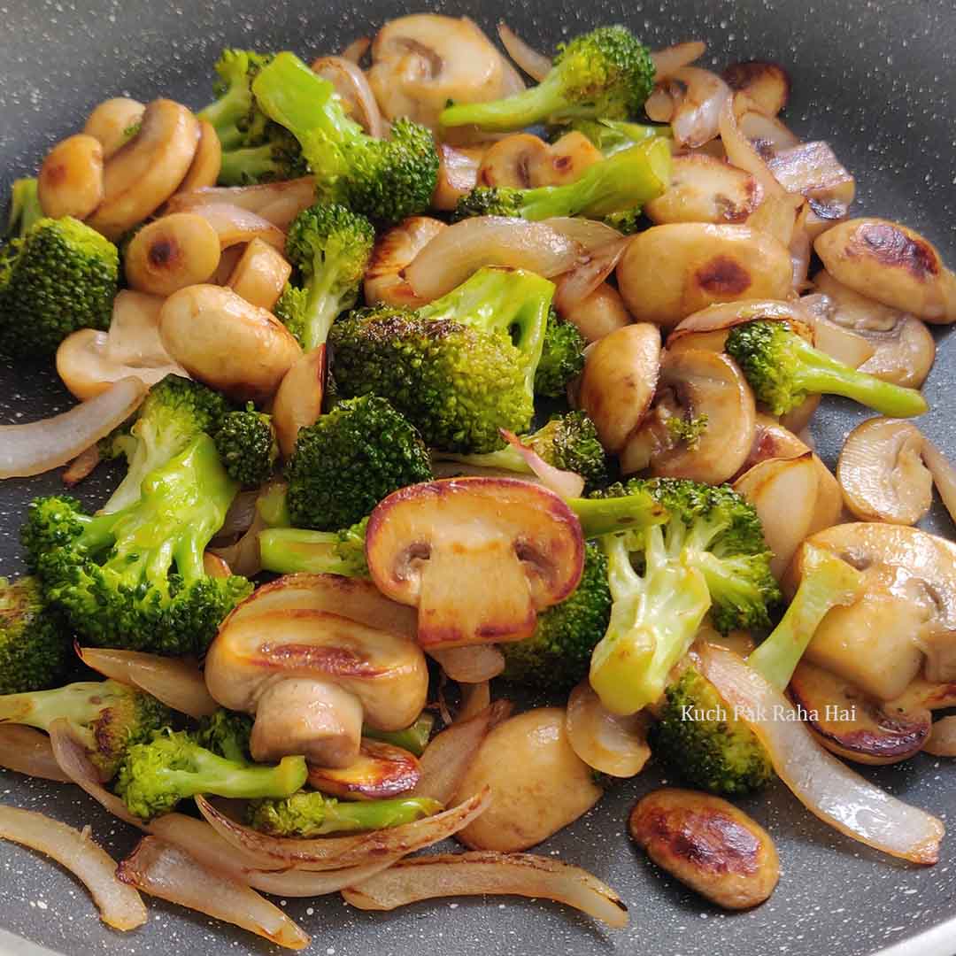 Sauteeing mushrooms broccoli onions