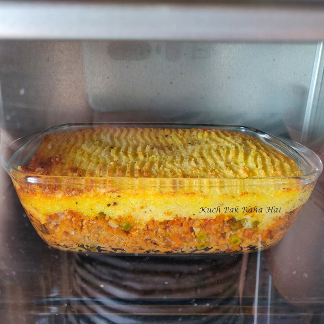 Baking cottage pie in oven.