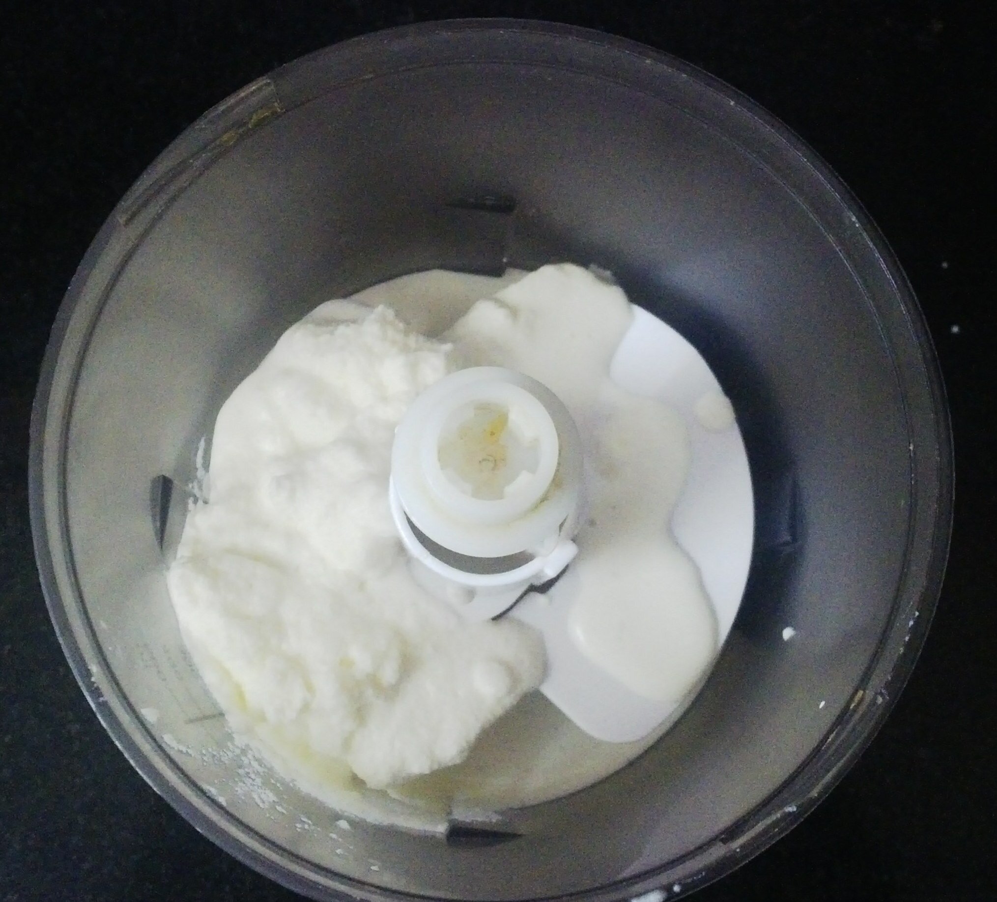 Adding cream to blender jar.