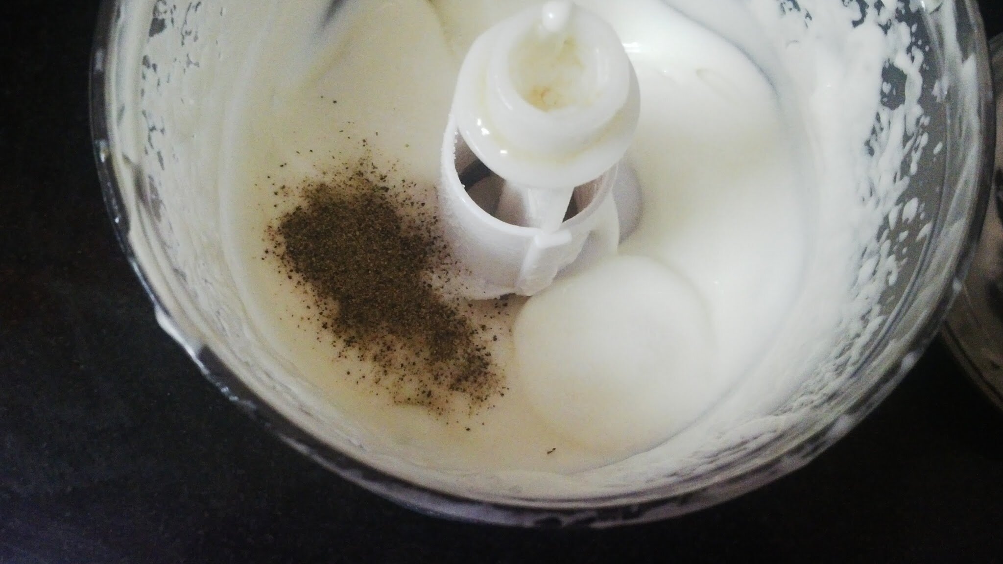 Adding seasoning to mayonnaise.