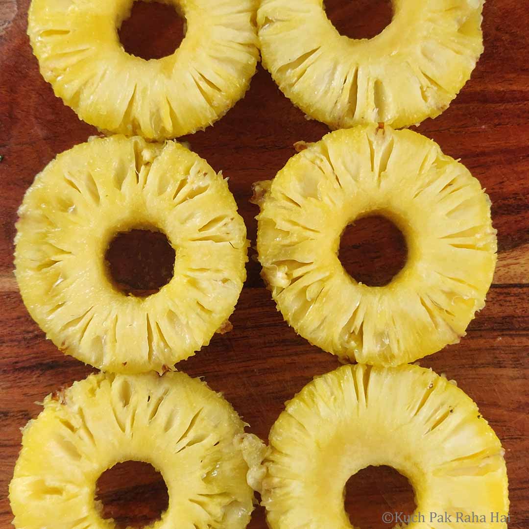 Peeled, cored & sliced pineapple rings.