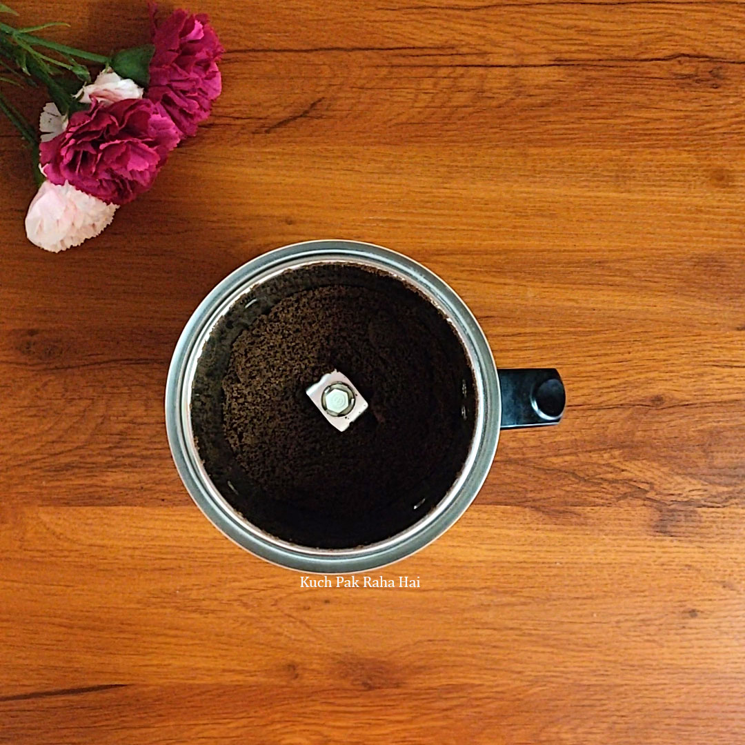 Adding butter to ground oreos.