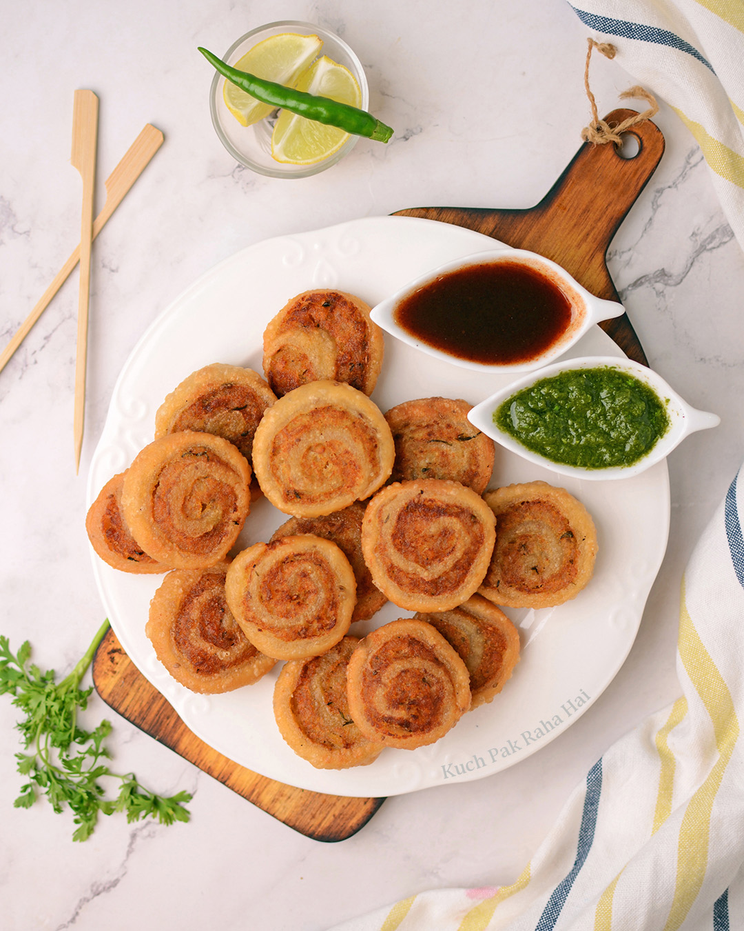 Samosa pinwheels served with imli chutney and hari chutney.