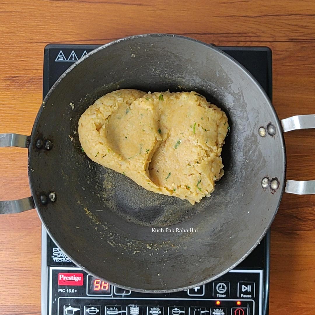 Preparing potato filling for samosa.