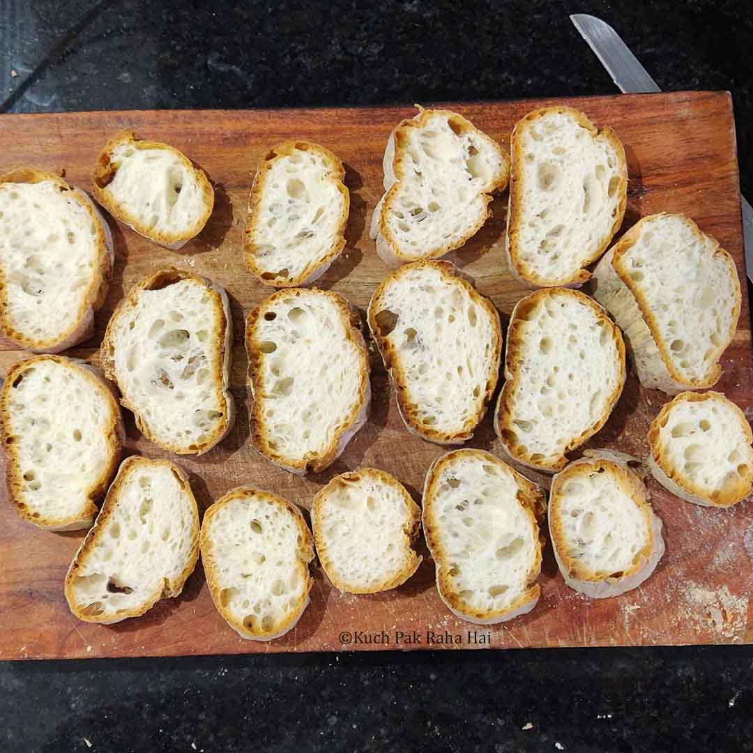 Cutting Baguette in slices.