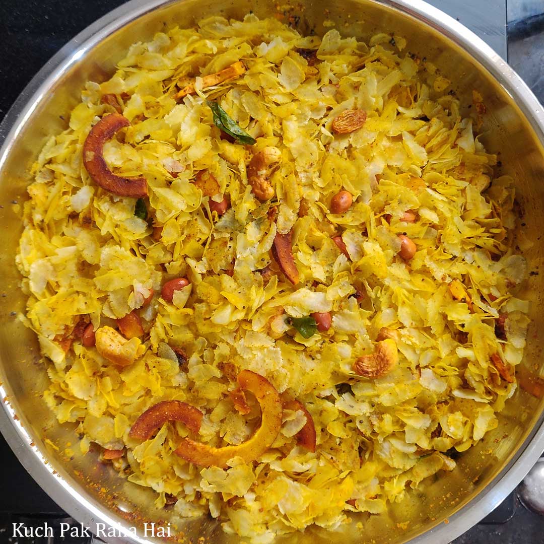 Mixing Poha Chivda Namkeen.