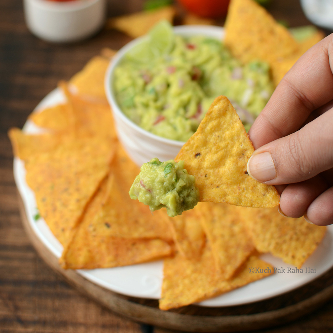 Nacho dipped in guacamole.