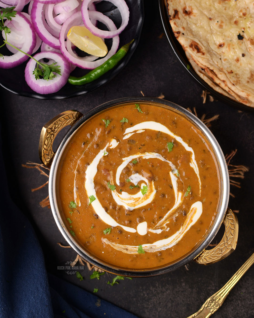 Creamy dal makhani served with naan.
