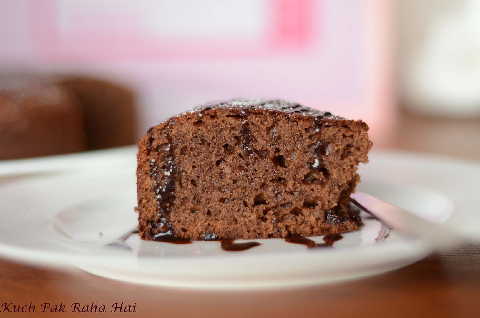 Chocolate cake slice drizzle with chocolate sauce