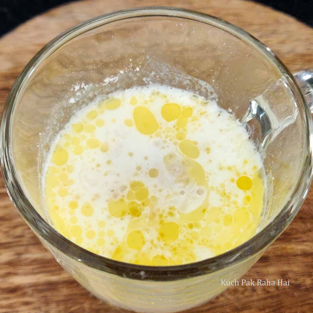 Adding wet ingredients to flour.
