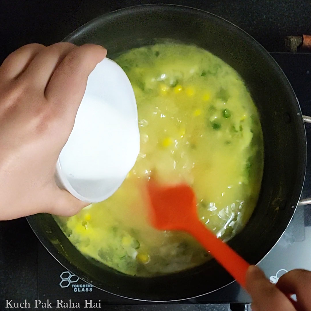 Adding cornstarch to thicken the soup.
