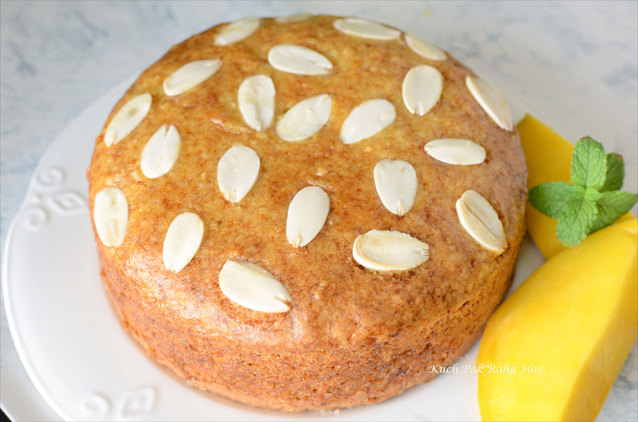 Eggless Mango Cake Recipe with fresh mangoes.