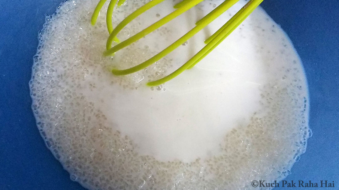 Whisking milk & sugar in a bowl.