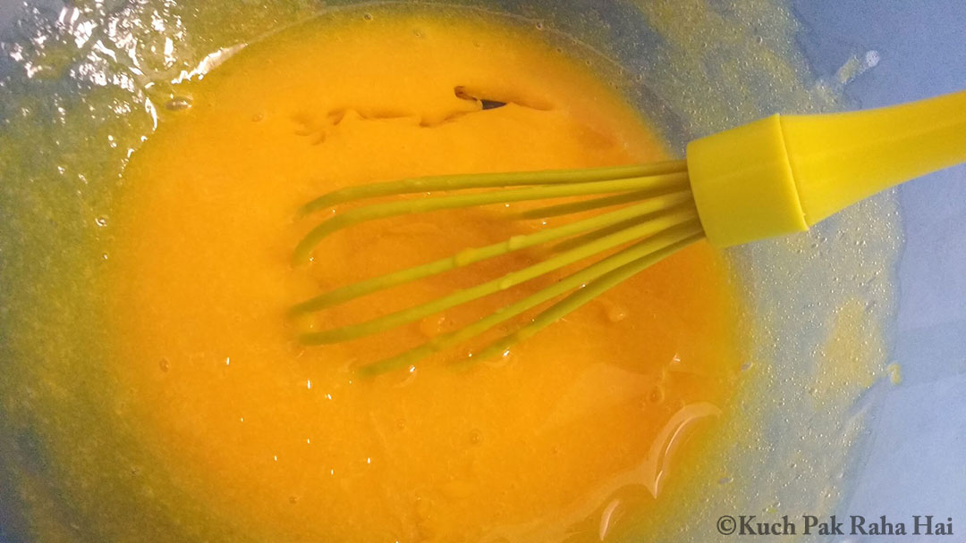 Whisking wet ingredients for mango cake.