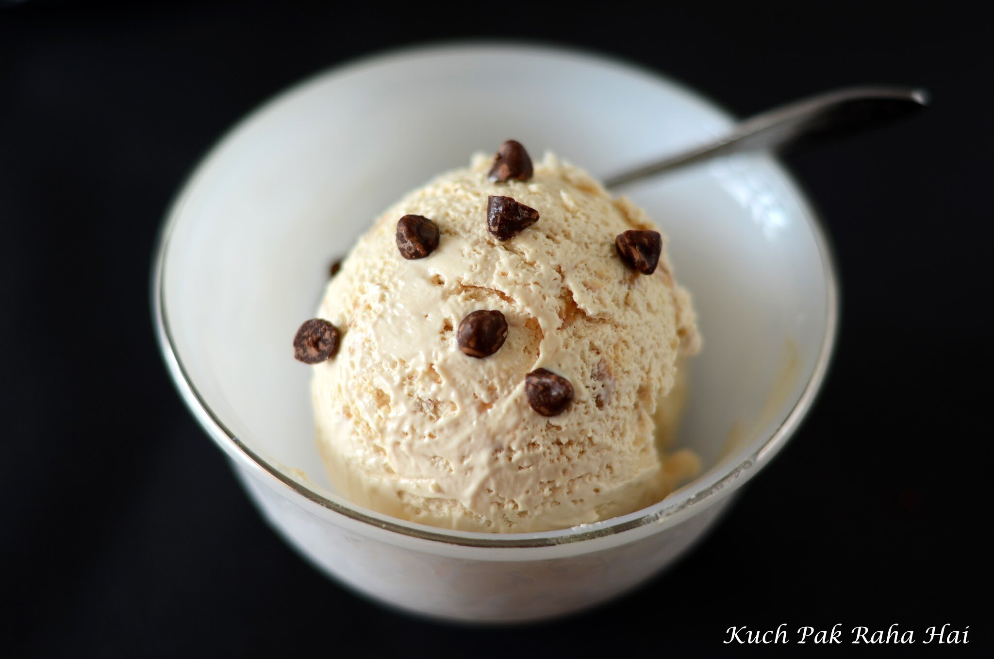 Dulce de leche ice cream scoop in a bowl.
