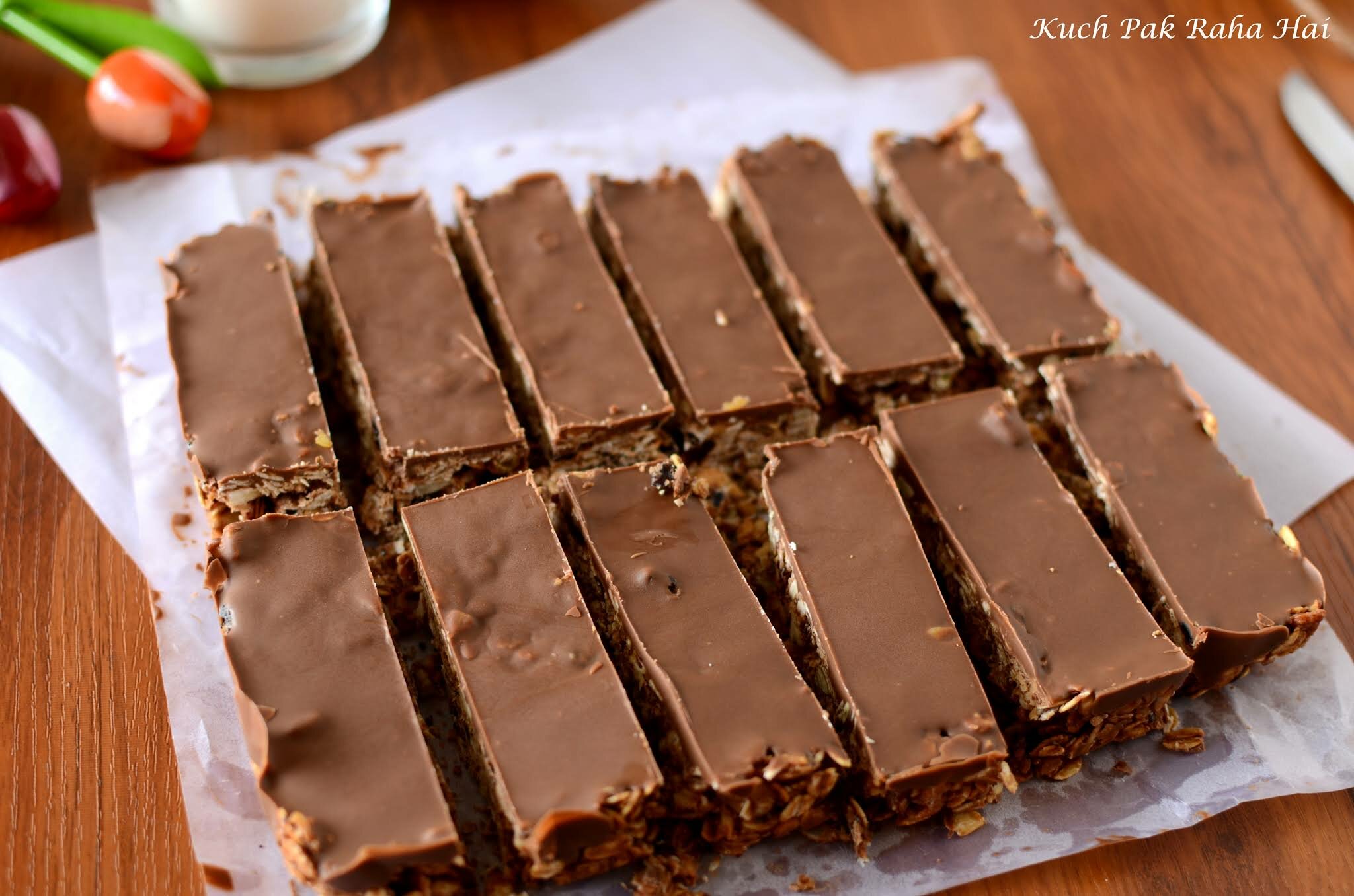 Cutting rectangle or square granola bars with sharp knife.