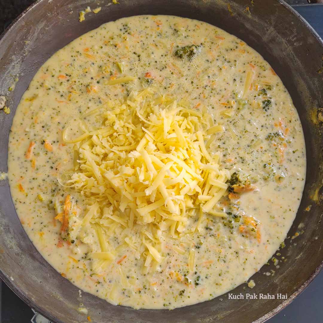 Adding cheese to the soup