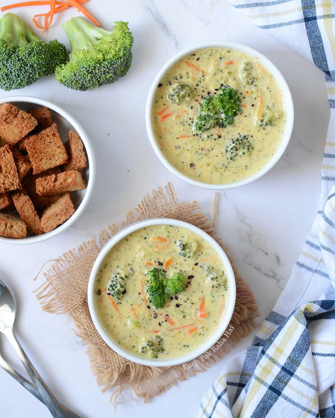 Cheddar broccoli soup bowls served with bread croutons.