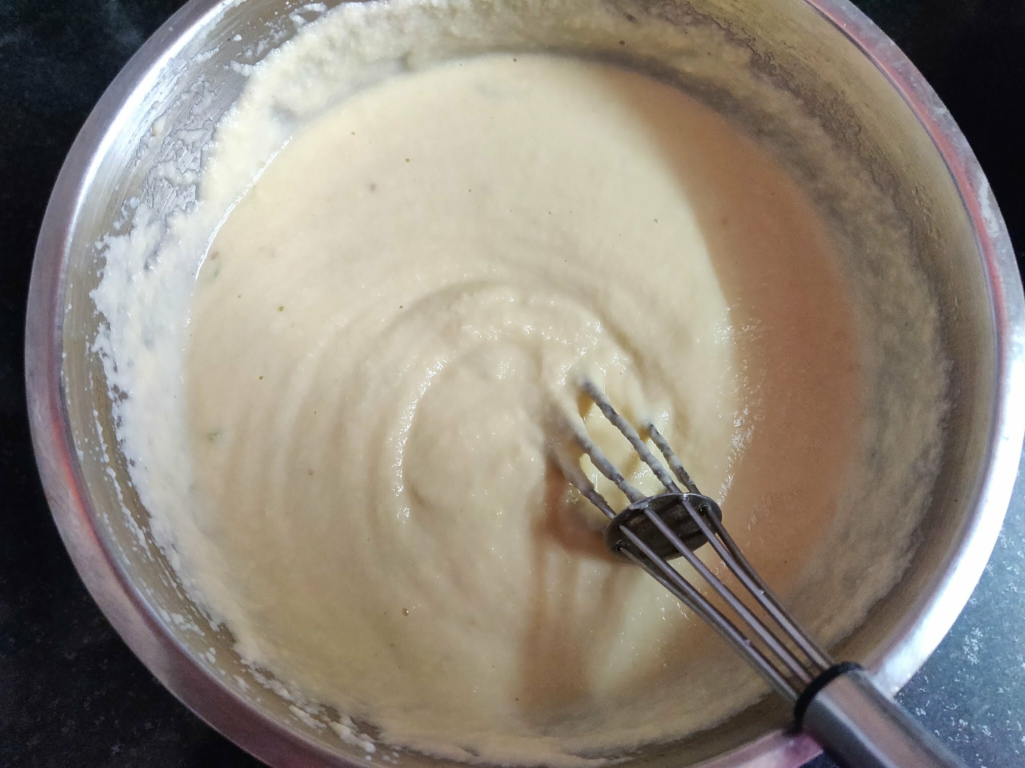 Whisking batter to aerate it.