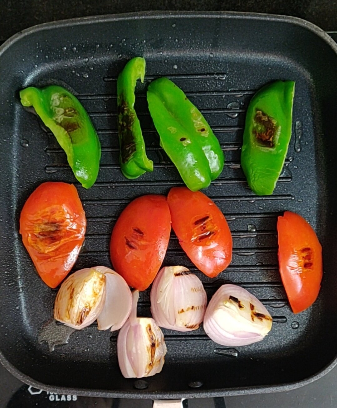 Cooking vegetables in grilling pan.