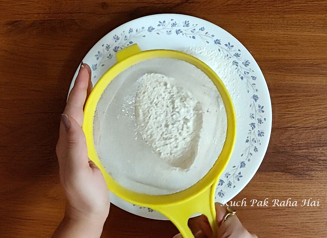 Sieving dry ingredients.