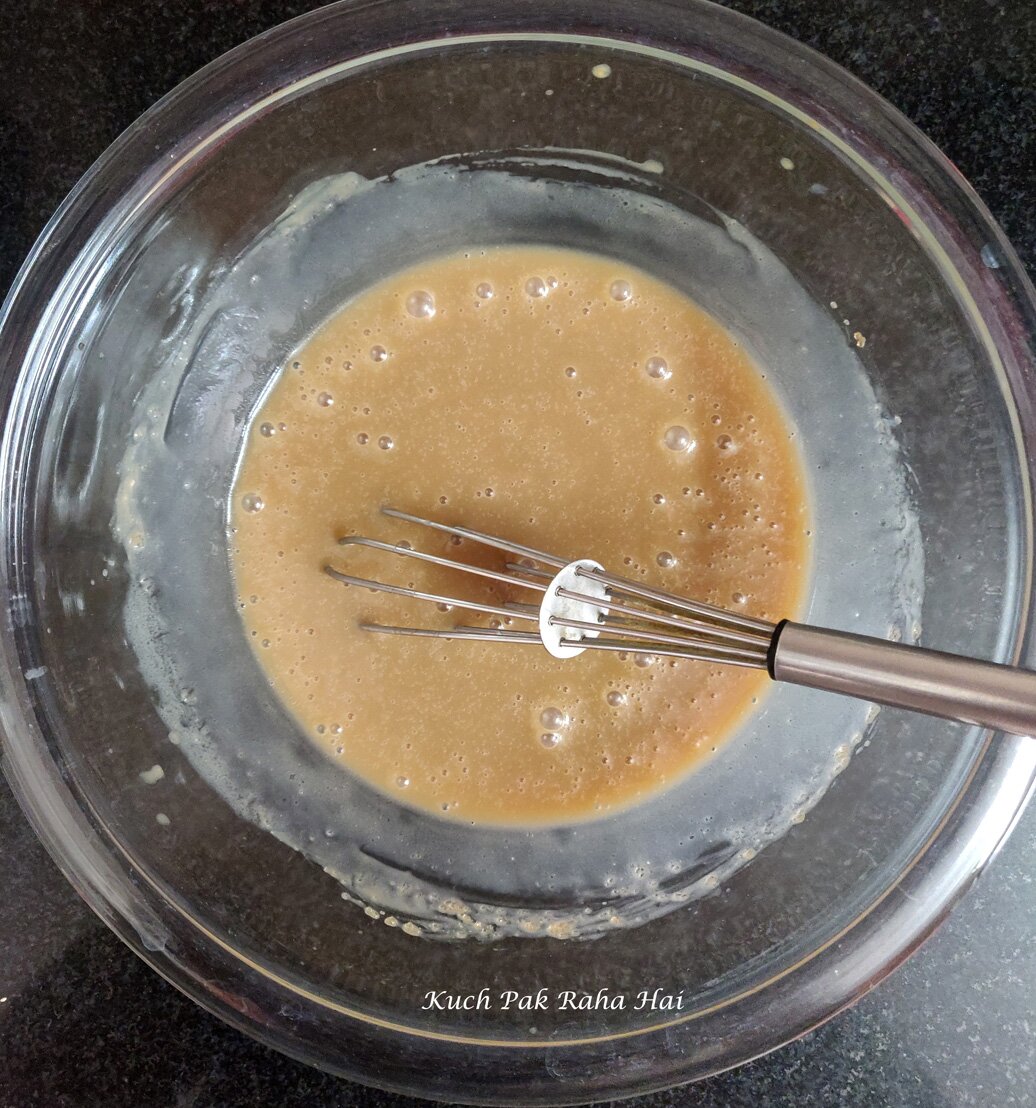 Mixing wet ingredients in a bowl.