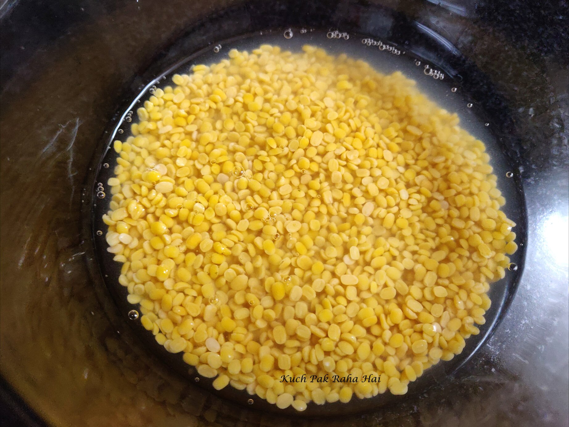 Soaking moong dal.