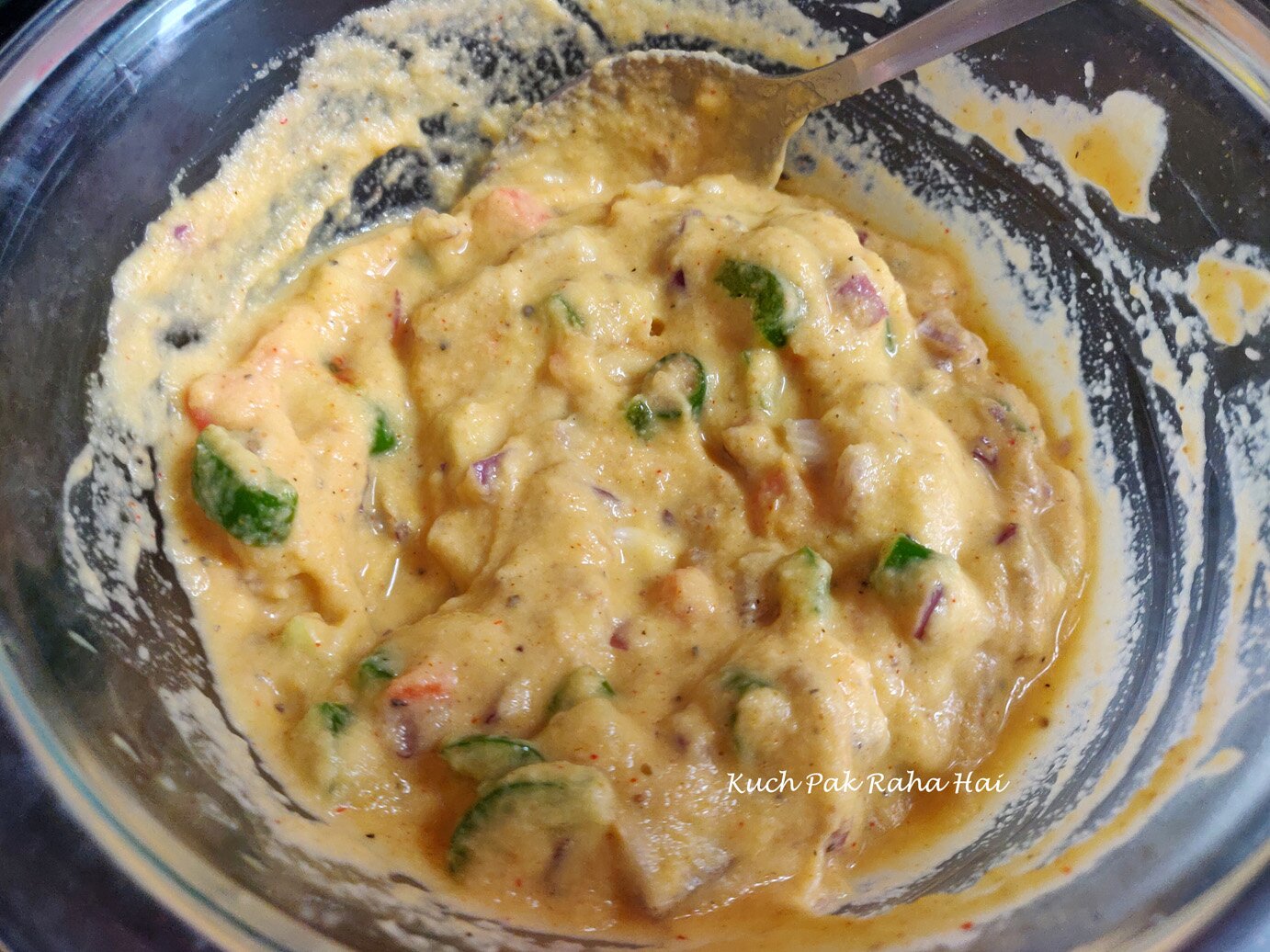 Mixing ground moong dal with vegetables.