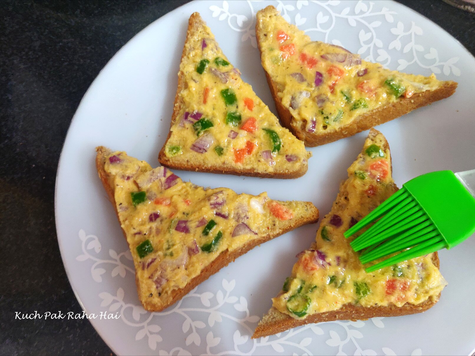 Brushing oil on moong dal toast before air frying.