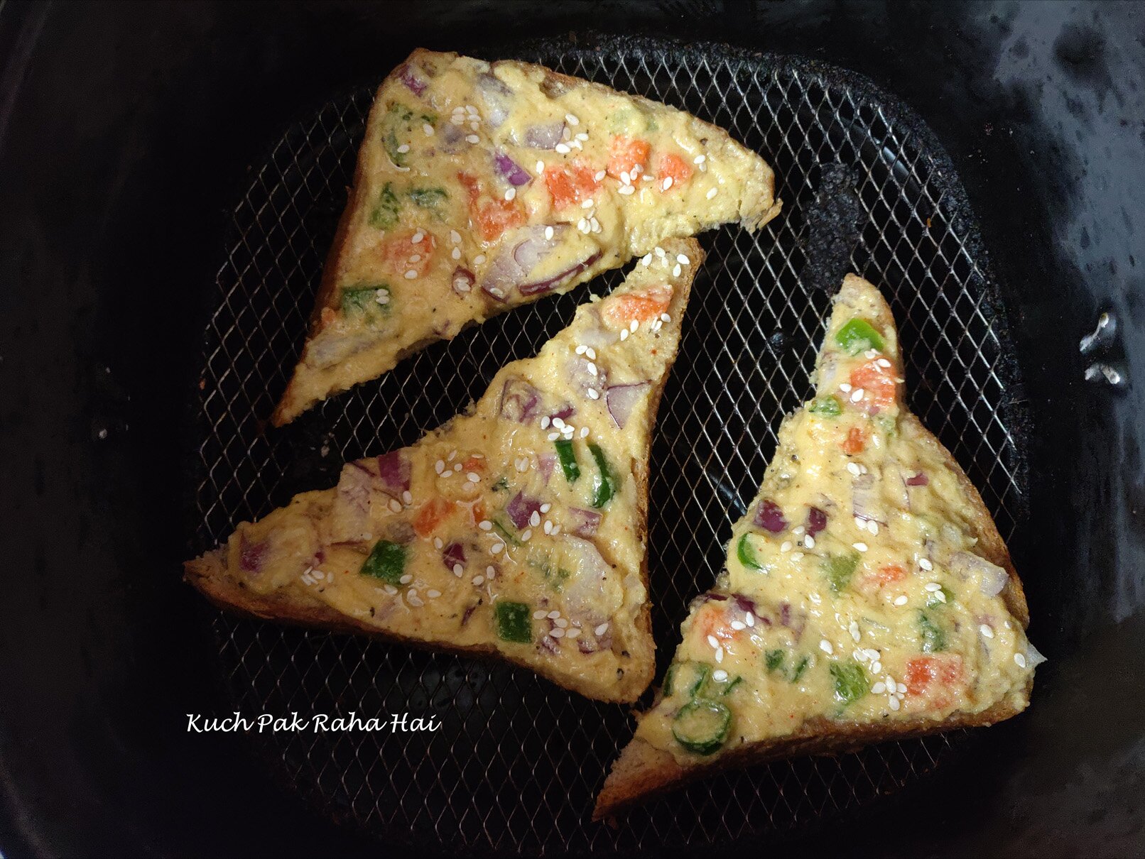 Moong dal toast in air fryer basket.