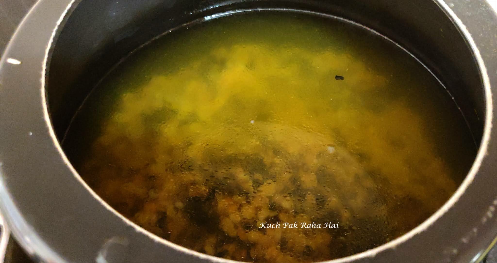 Cooking dal in pressure cooker.