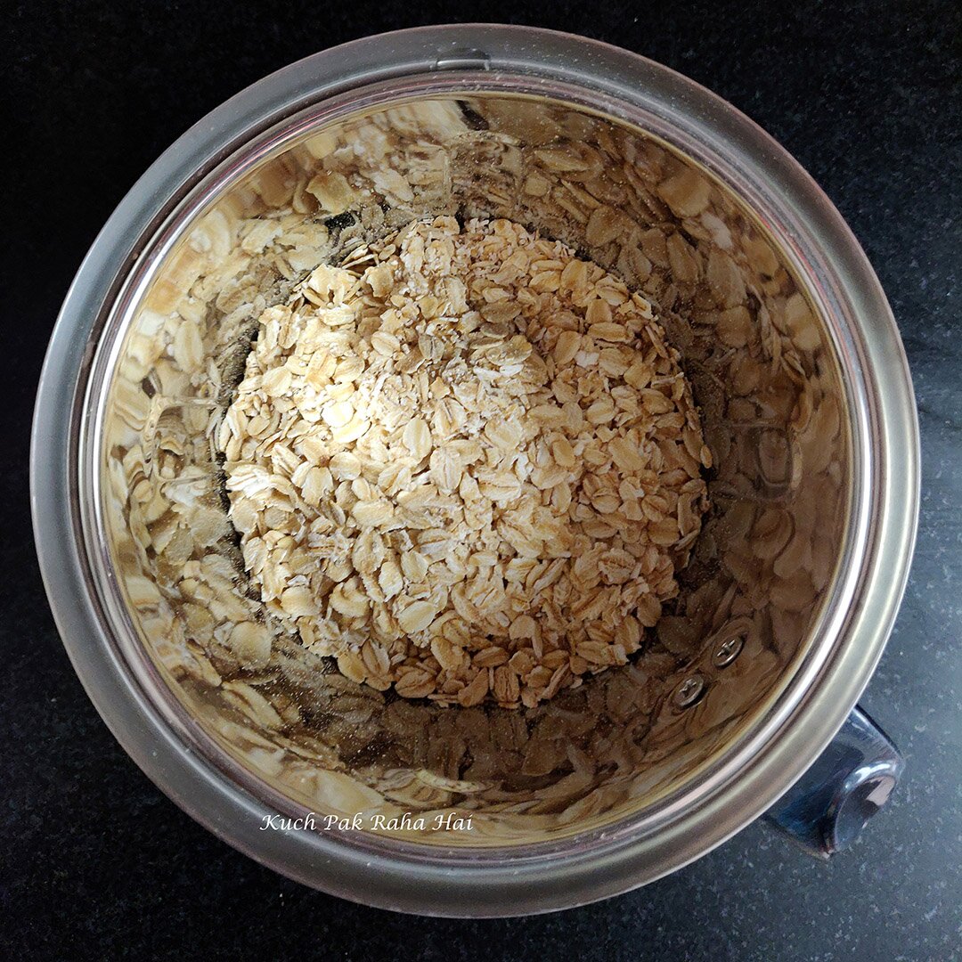 Grinding oats in a grinder jar.
