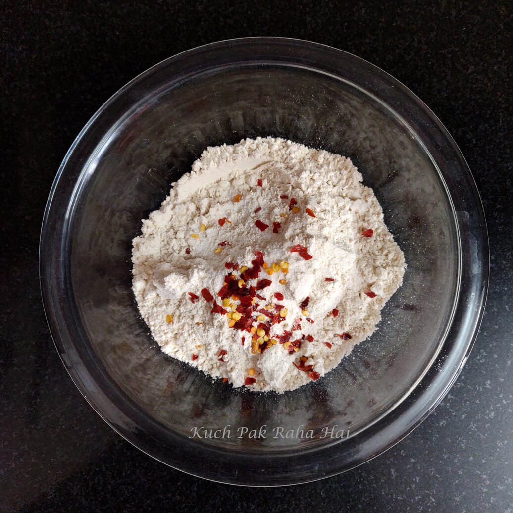 Mixing dry ingredients in a bowl.