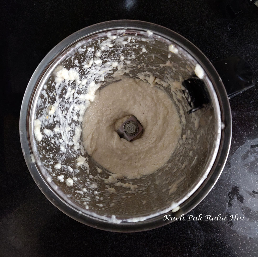 Grinding urad dal in grinder jar.