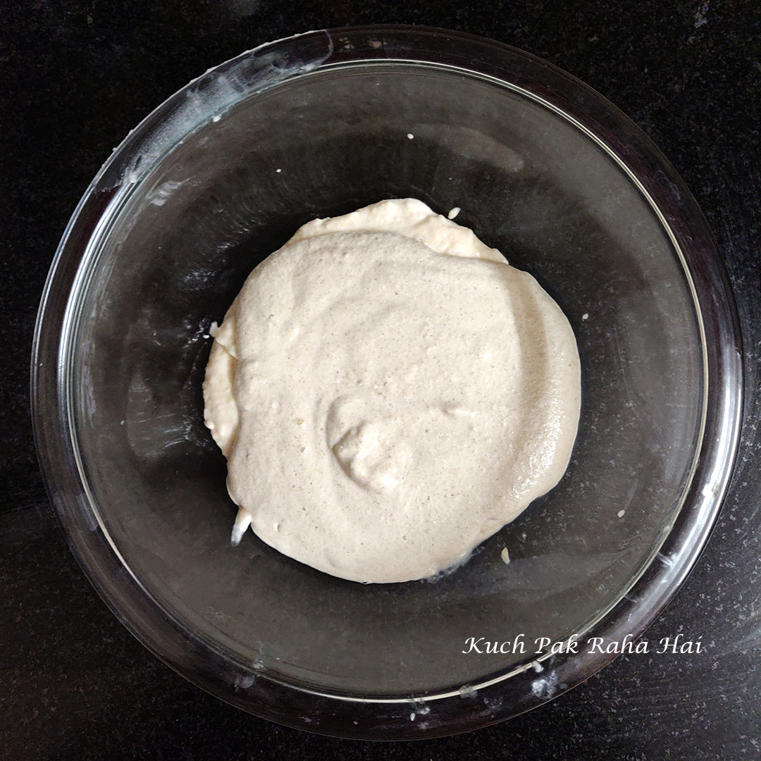 Mixing quinoa with dal to make appe batter.