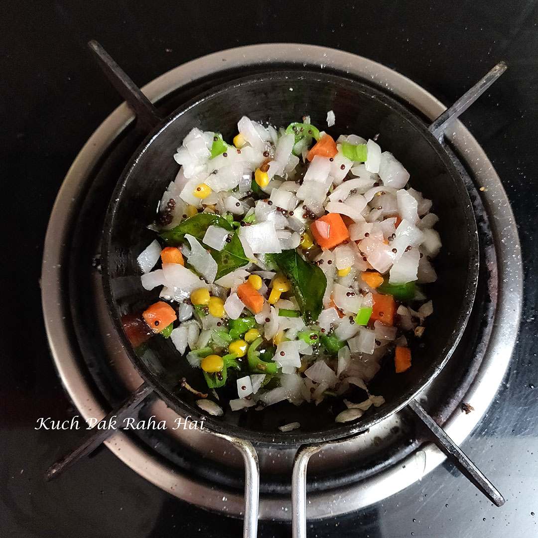 Sautéing spices and veggies in oil.