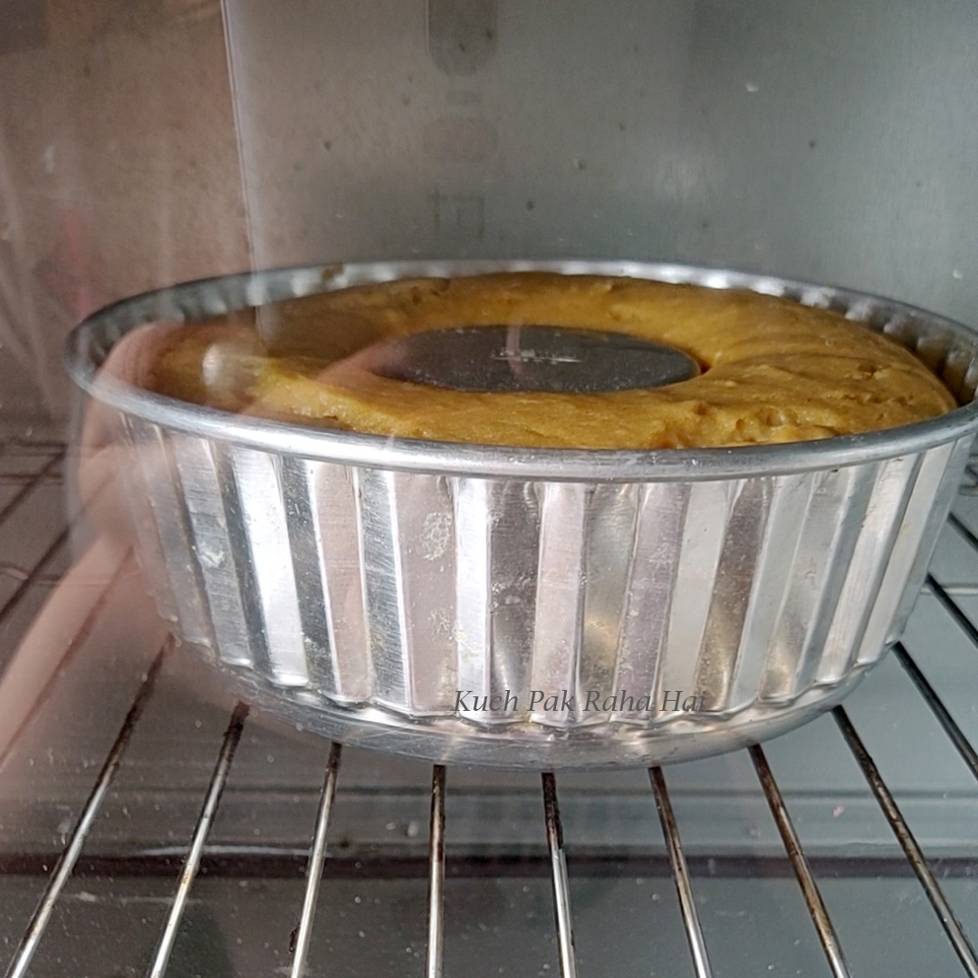 Baking pumpkin cake in oven.