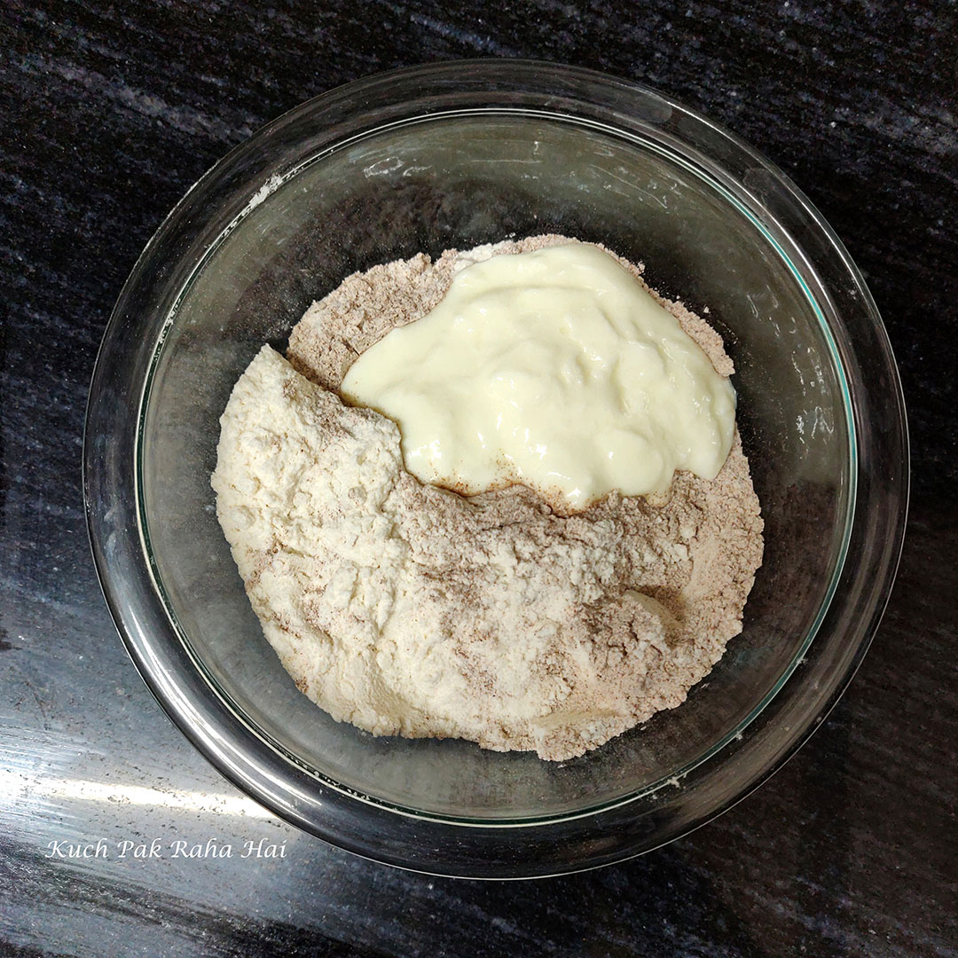 Ragi flour, rice flour & curd in a bowl.