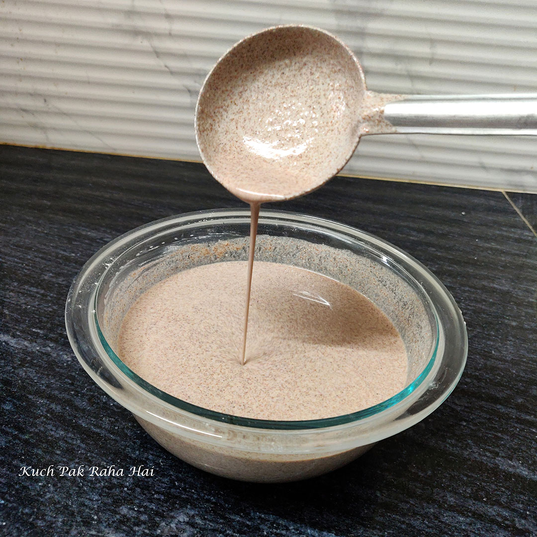 Checking ragi dosa batter consistency.